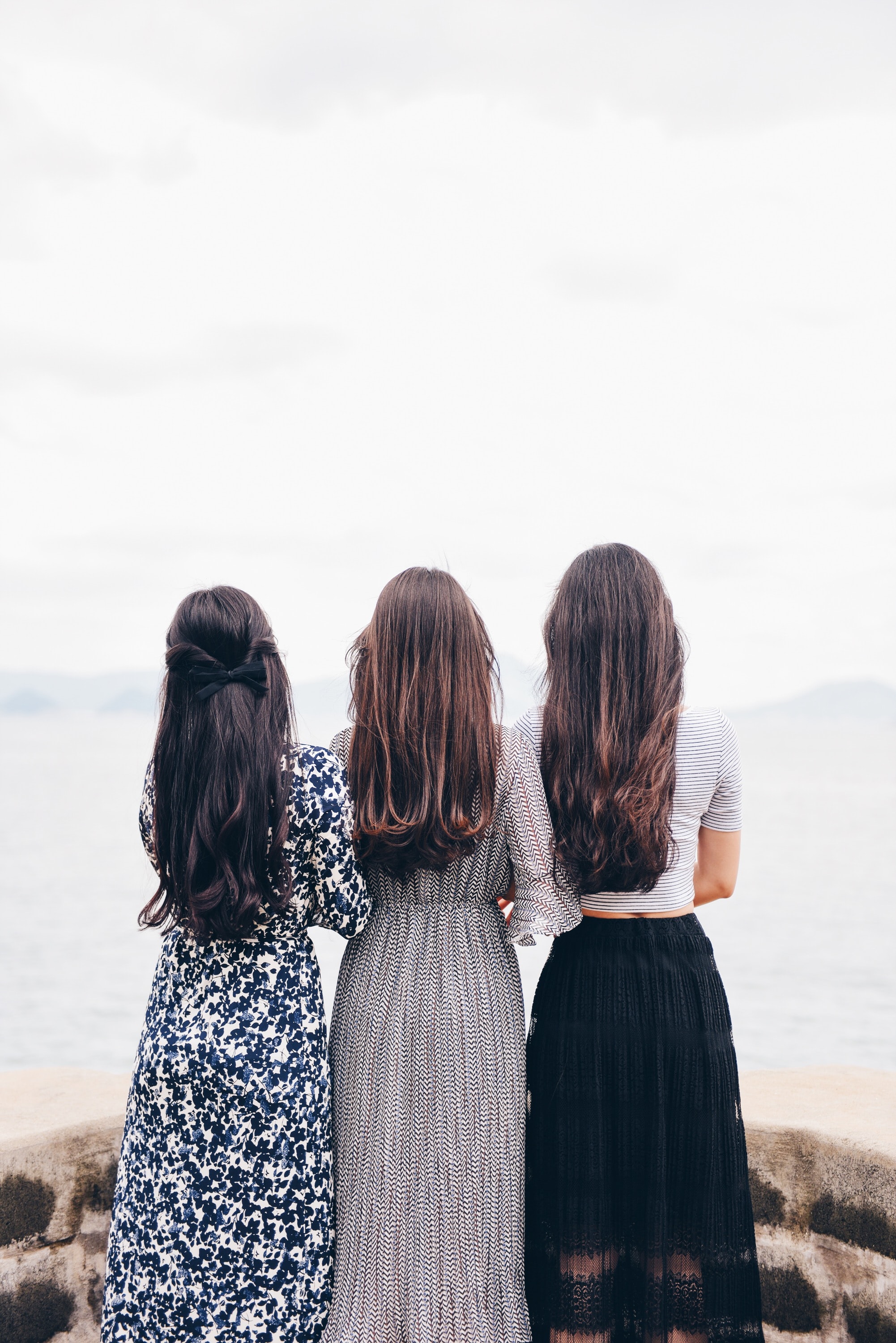 three girls with long hair